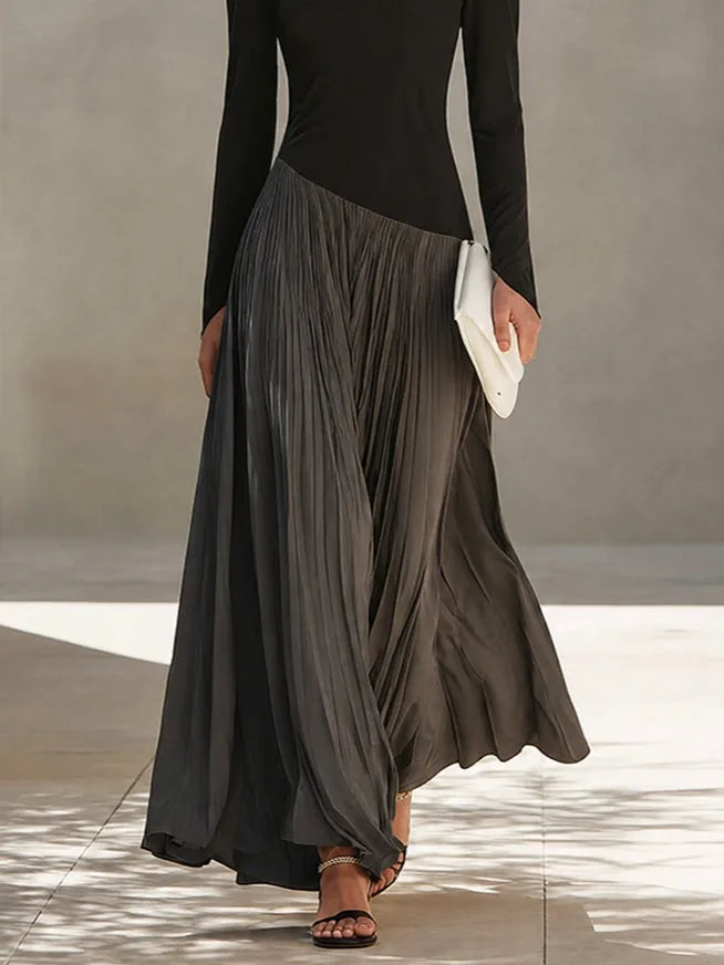 Women's black and grey color-block pleated maxi dress, skirt in motion