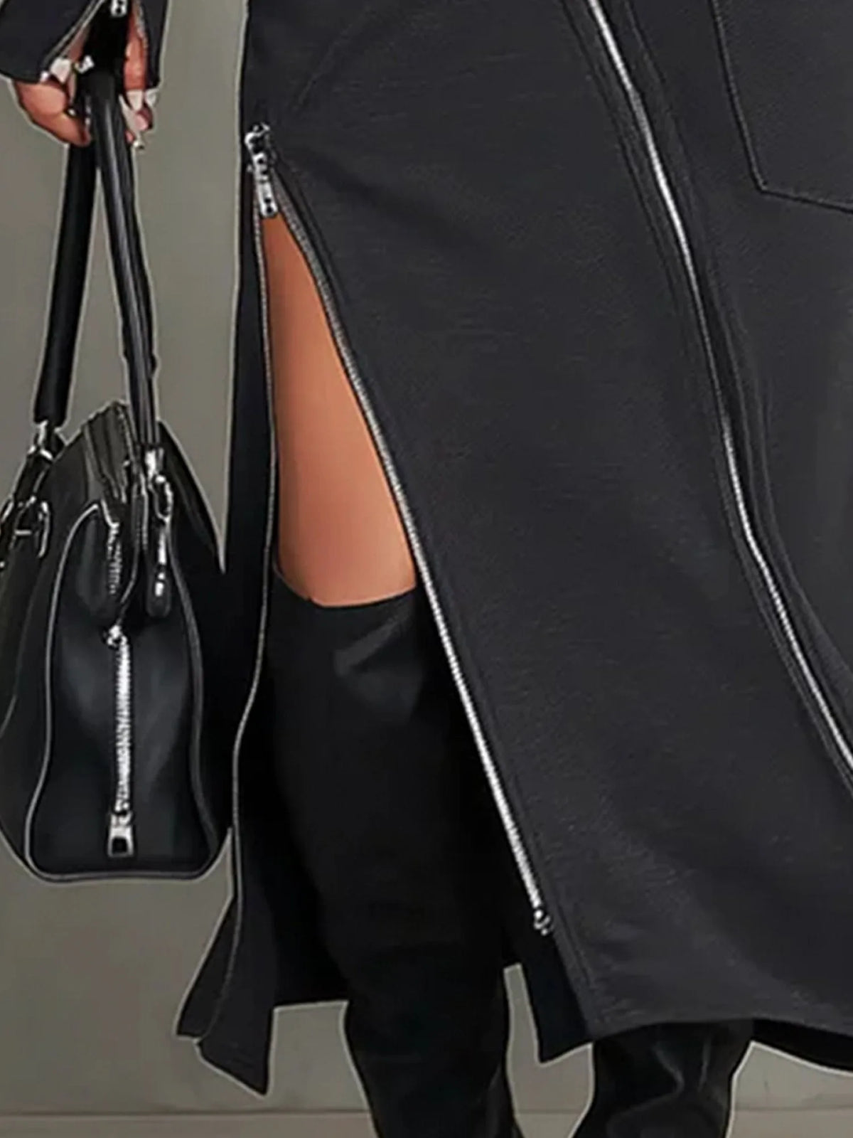 Women's high-neck top and zipper-slit skirt set, close-up of the side zipper slit