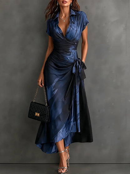 Women's abstract print wrap midi dress with tie waist, blue, front view with handbag