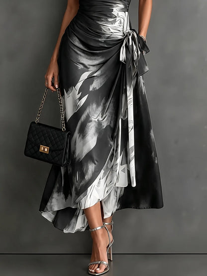 Women's abstract print wrap midi dress with tie waist, grey, side view showing the tie waist