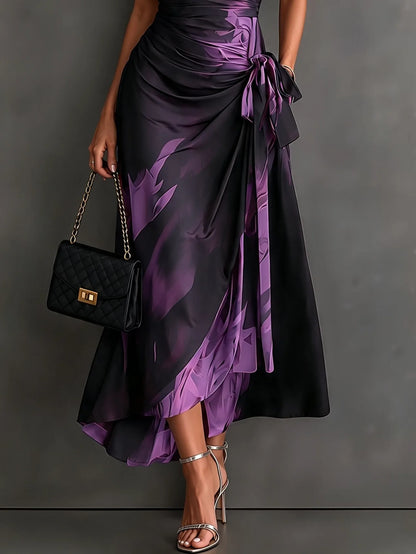 Women's abstract print wrap midi dress with tie waist, side view showing the ruffled hem