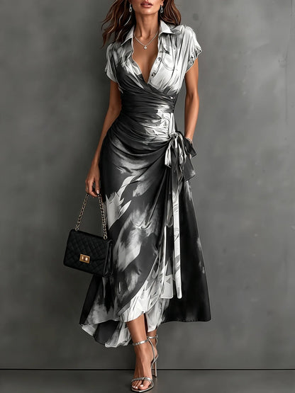 Women's abstract print wrap midi dress with tie waist, white, front view with handbag