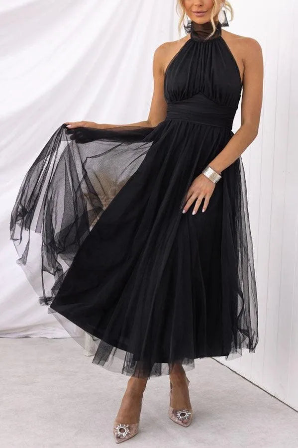 Women's adjustable-tie halter maxi dress with flowing skirt, black, skirt in motion