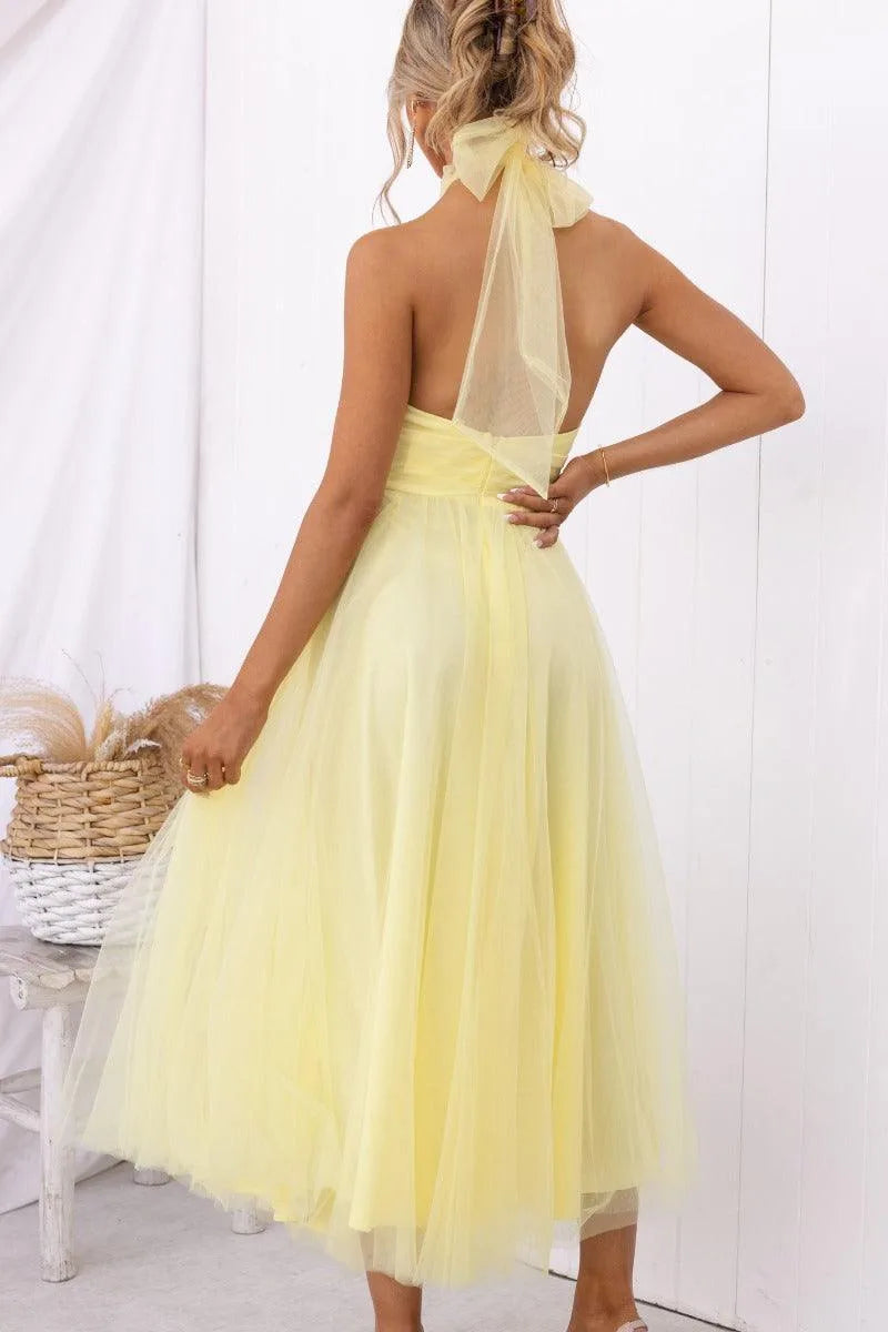 Women's adjustable-tie halter maxi dress with flowing skirt, yellow, back view