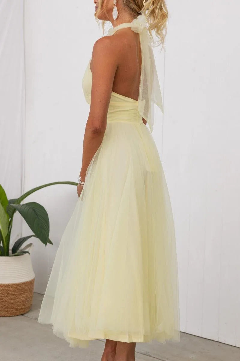 Women's adjustable-tie halter maxi dress with flowing skirt, yellow, back view