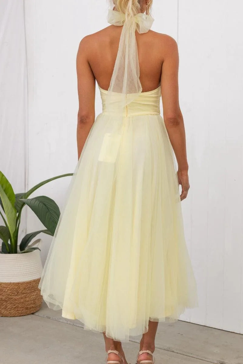 Women's adjustable-tie halter maxi dress with flowing skirt, yellow, back view