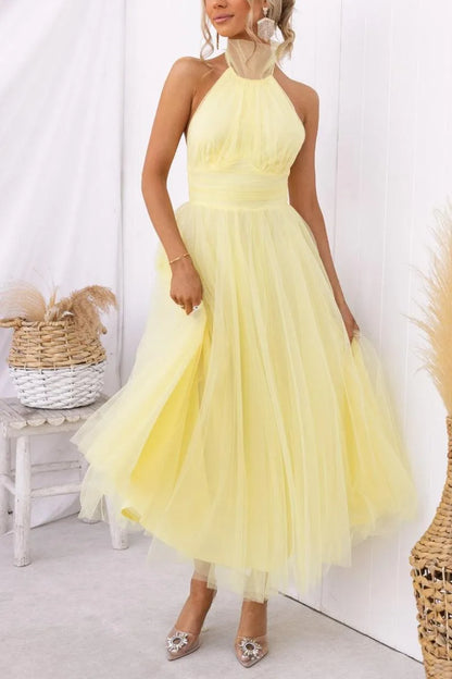 Women's adjustable-tie halter maxi dress with flowing skirt, yellow, front view