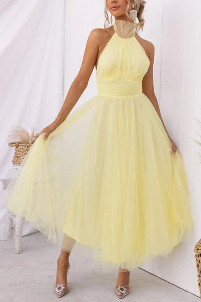 Women's adjustable-tie halter maxi dress with flowing skirt, yellow, skirt in motion