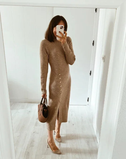 Woman in a camel knit button-front midi dress holding a handbag