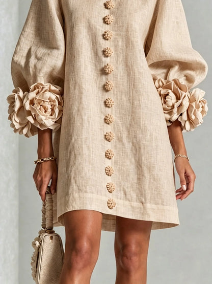 Women's beige button-front mini dress with floral rose cuffs, close-up of the rose cuff