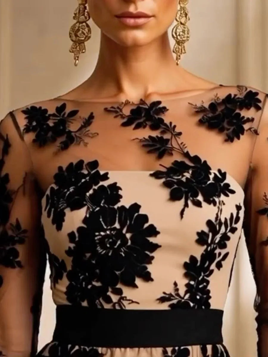 Women's black floral lace midi dress with banded skirt, close-up of the floral lace bodice and waist band