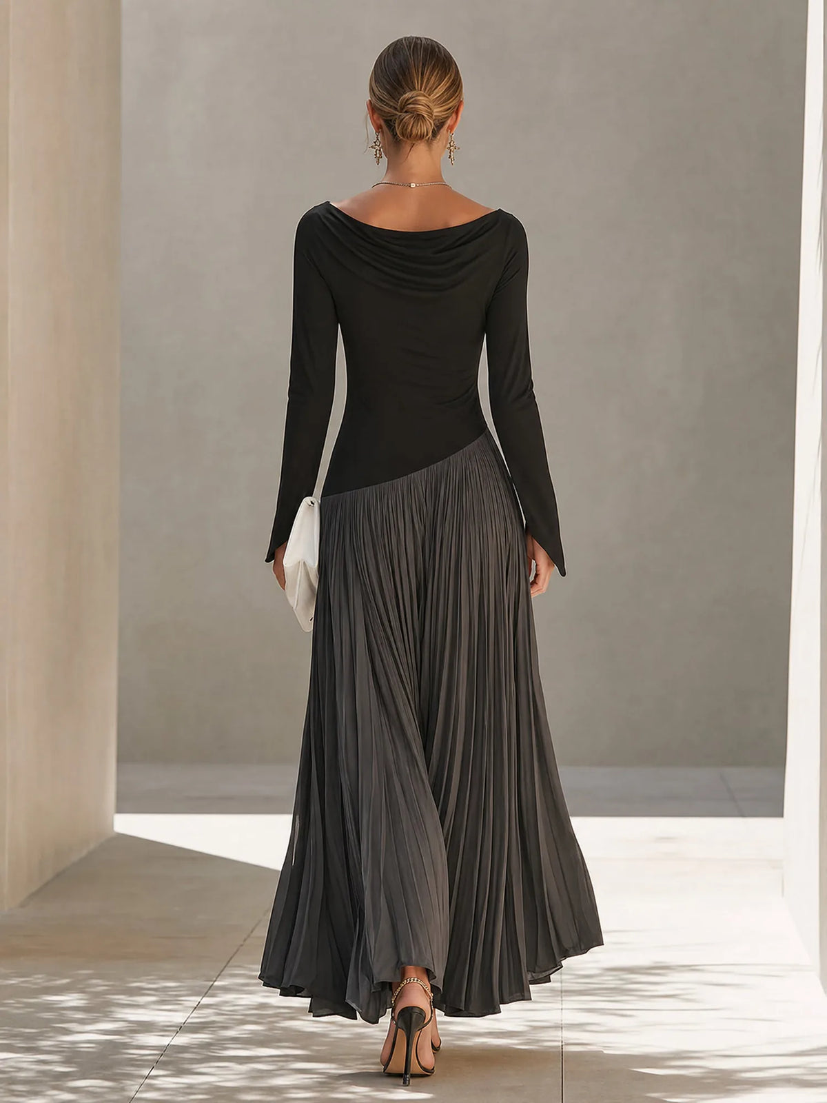 Women's black and grey color-block pleated maxi dress, back view
