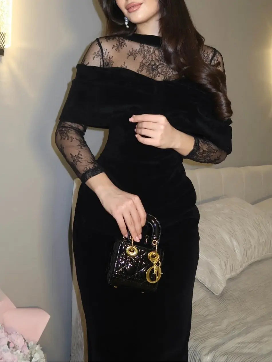 Black fitted maxi dress with lace details, side view