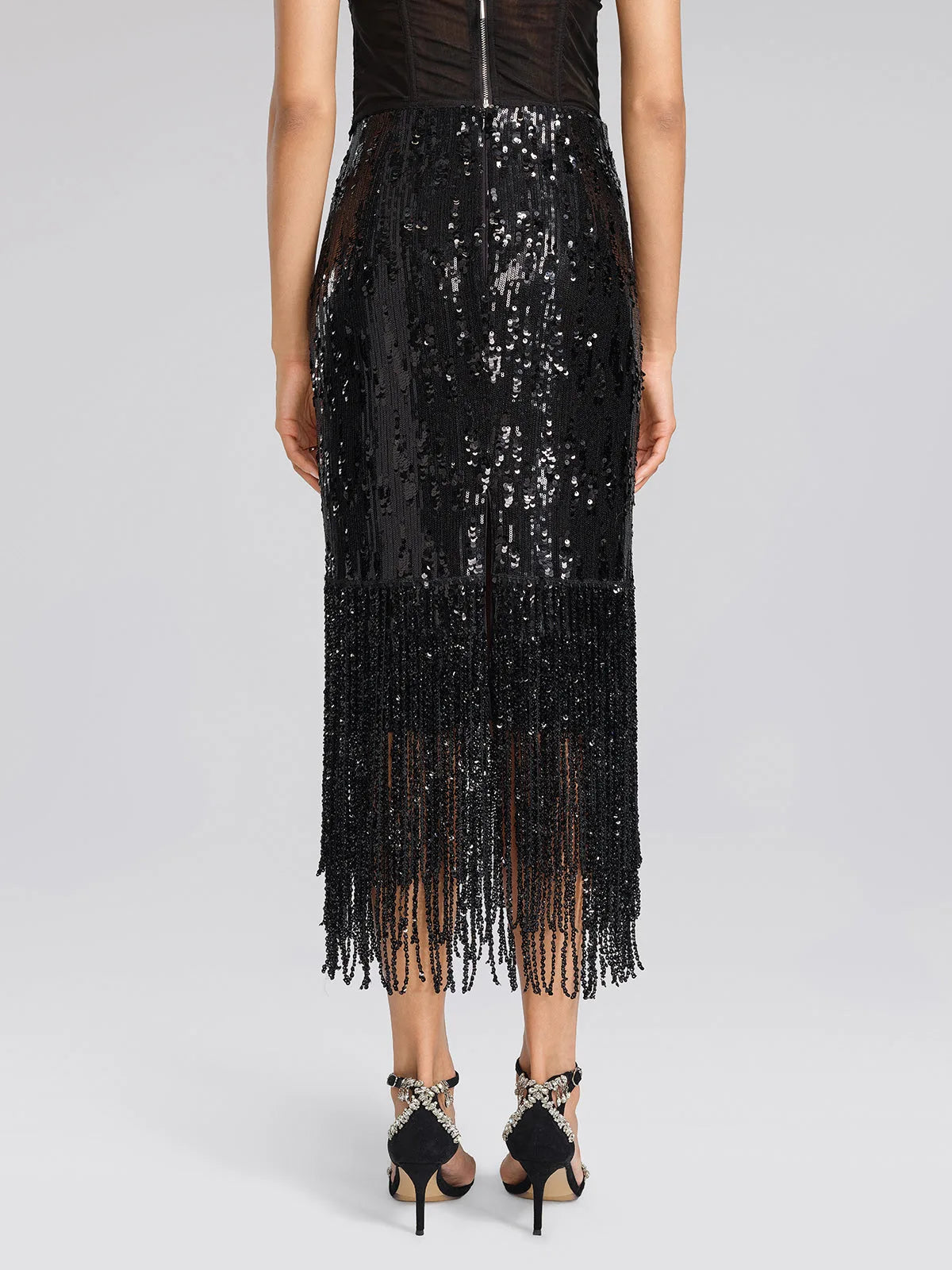 Women's black sequin fringe midi skirt with slit, front view close-up