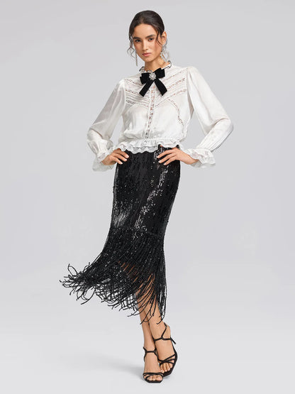 Women's black sequin fringe midi skirt with slit, styled with a white blouse