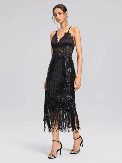 Women's black sequin fringe midi skirt with slit, worn with a lace camisole, front view