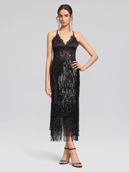 Women's black sequin fringe midi skirt with slit, worn with a lace camisole