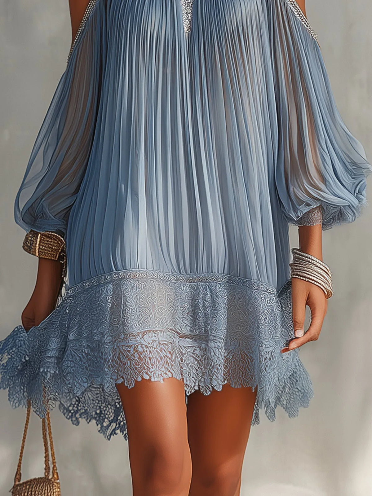 Women's blue cold-shoulder mini dress with lace hem, close-up of the lace hem and sheer sleeves