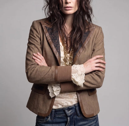 Women's brown fitted blazer with contrast lapels, front view with arms crossed
