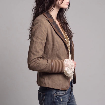 Women's brown fitted blazer with contrast lapels, side view