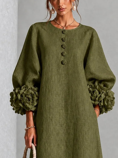 Women's button-front midi dress with floral rose cuffs, olive, close-up of the buttons and rose cuff