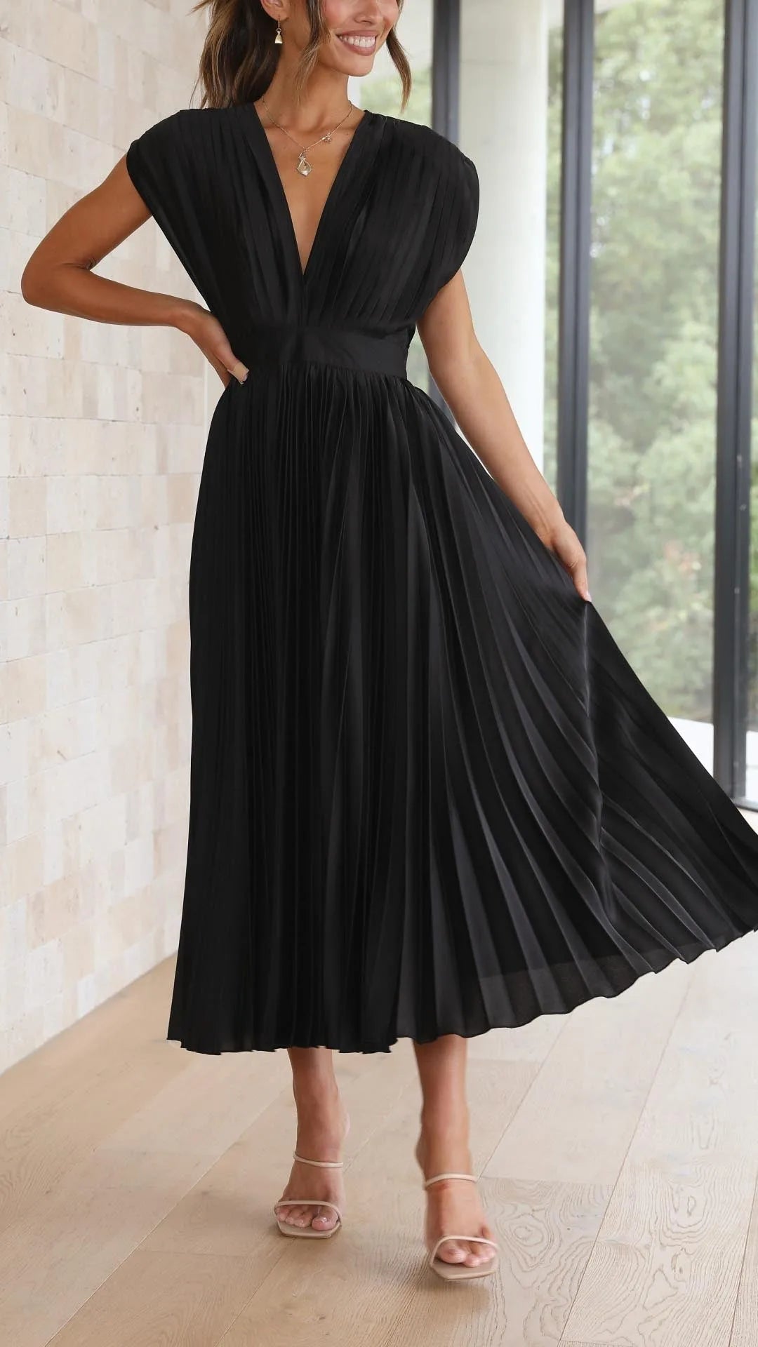 Women's draped V-neck pleated midi dress with cap sleeves, black, skirt in motion