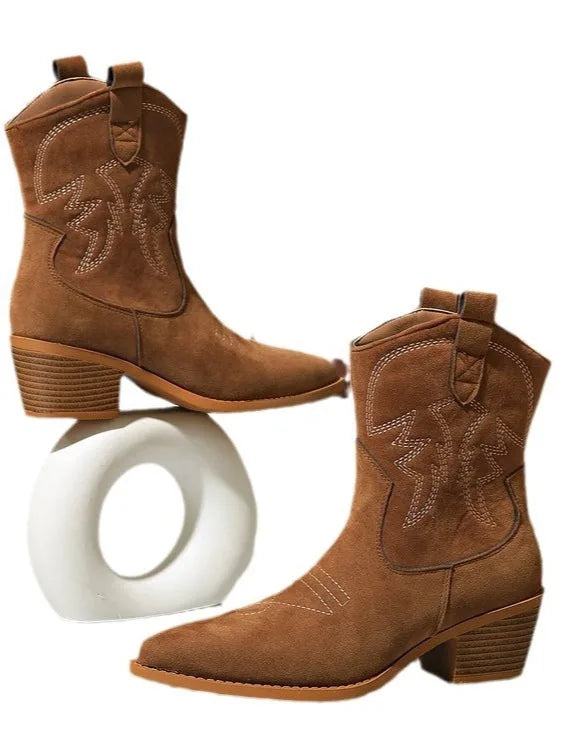Women's embroidered western ankle boots with block heel, pair on a display piece
