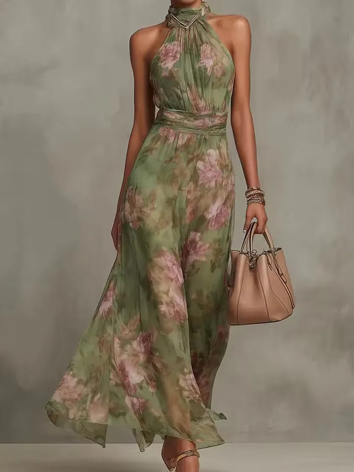 Women's floral halter maxi dress with gathered waist, front view with handbag