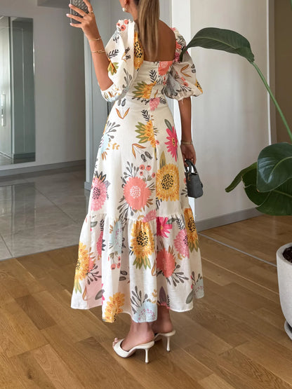Women's floral midi dress with square neck and puff sleeves, back view