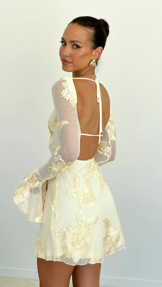 Women's floral mini dress with sheer bell sleeves and open back, cream, back view with open back