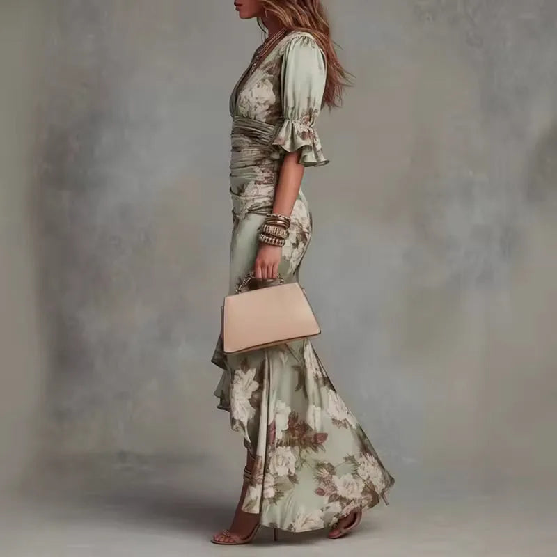 Women's floral V-neck maxi dress with bell sleeves and asymmetric hem, green, side view with handbag