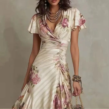 Women's floral wrap-effect midi dress with flutter sleeves, close-up of the V-neckline and sleeve