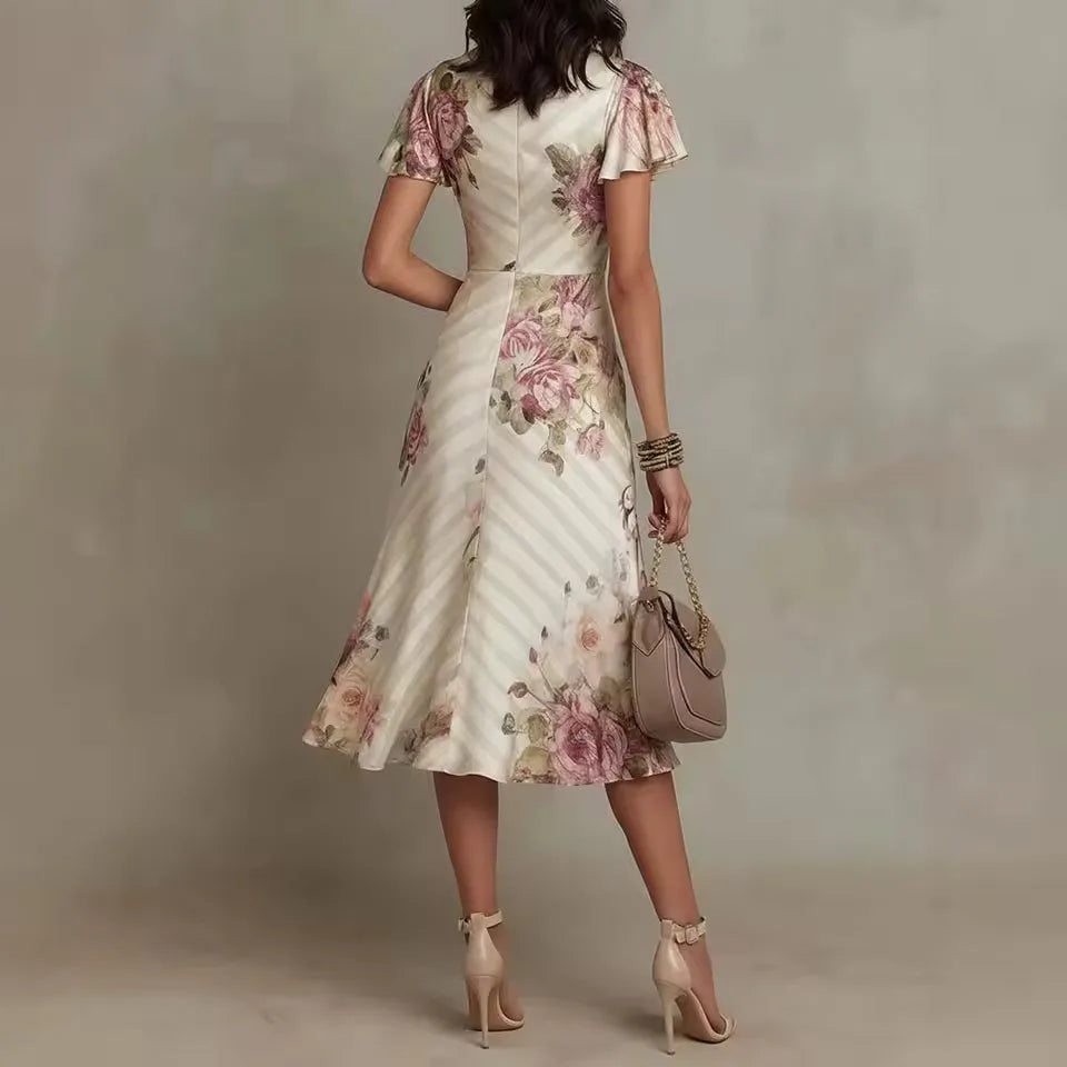 Women's floral wrap-effect midi dress with flutter sleeves, side view