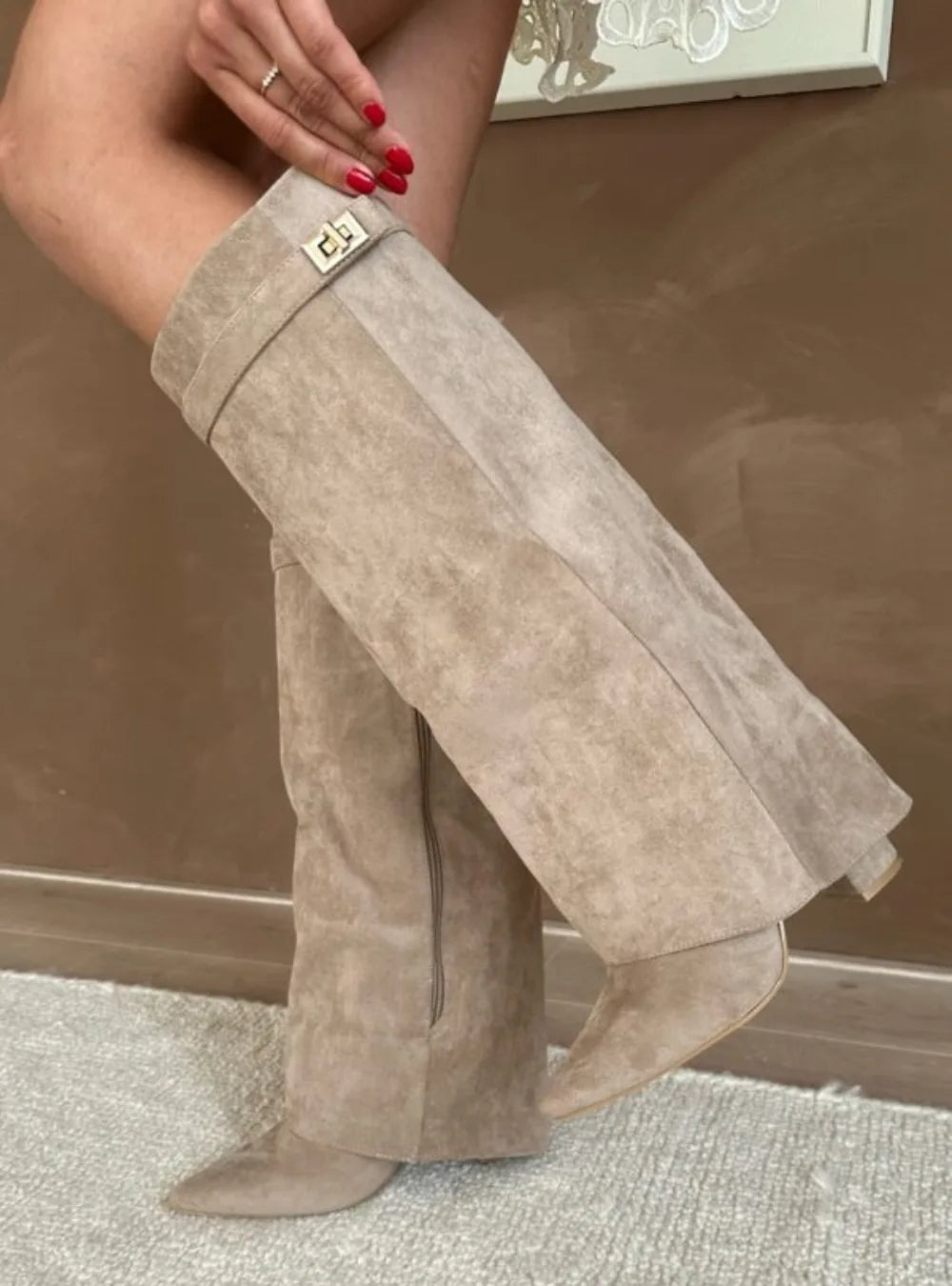 Women's fold-over knee-high boots with gold buckle, beige, close-up of the buckle