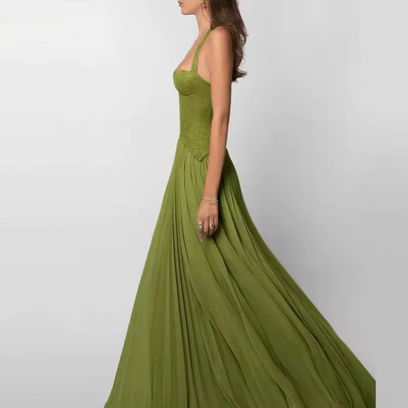 Women's green corset-style maxi dress with pleated skirt, side view showing the pleated skirt