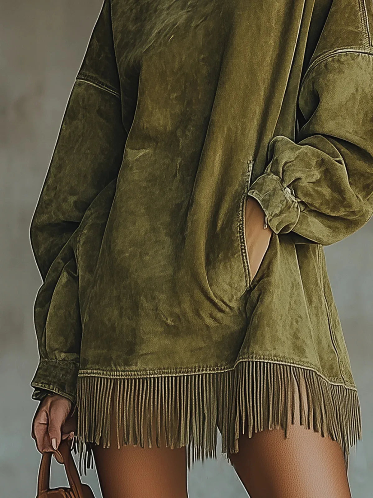 Women's high-neck fringe-hem tunic dress with balloon sleeves, green, close-up of the fringed hem