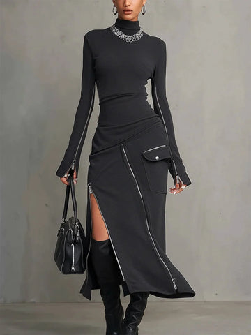 Women's high-neck top and zipper-slit skirt set, front view with handbag