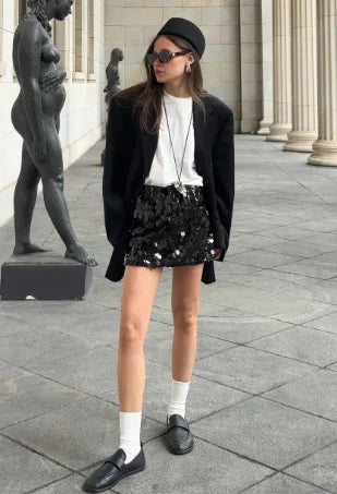 Women's high-waist sequin mini skirt, black, styled with socks and loafers