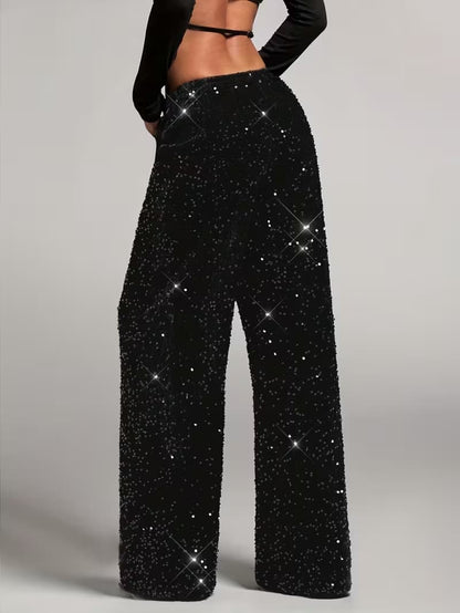 Sequin palazzo trousers worn with a bodysuit, full-length view