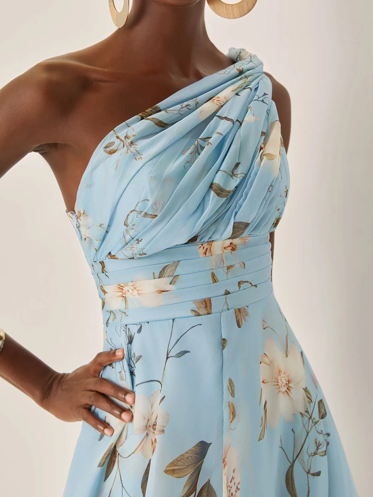 Women's light blue floral one-shoulder maxi dress, close-up of the draped shoulder