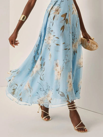 Women's light blue floral one-shoulder maxi dress, close-up of the floral skirt