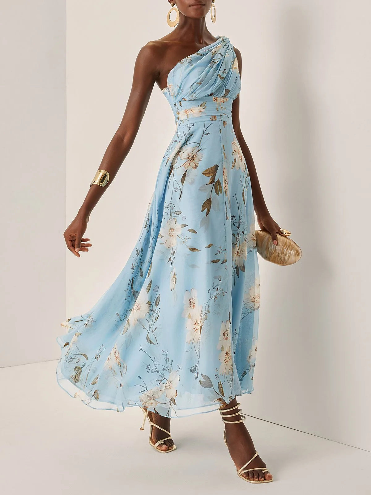 Women's light blue floral one-shoulder maxi dress, skirt in motion