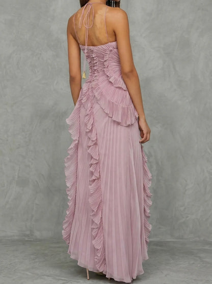 Women's lilac halter maxi dress with ruffles and asymmetric skirt, back view with lace-up detail