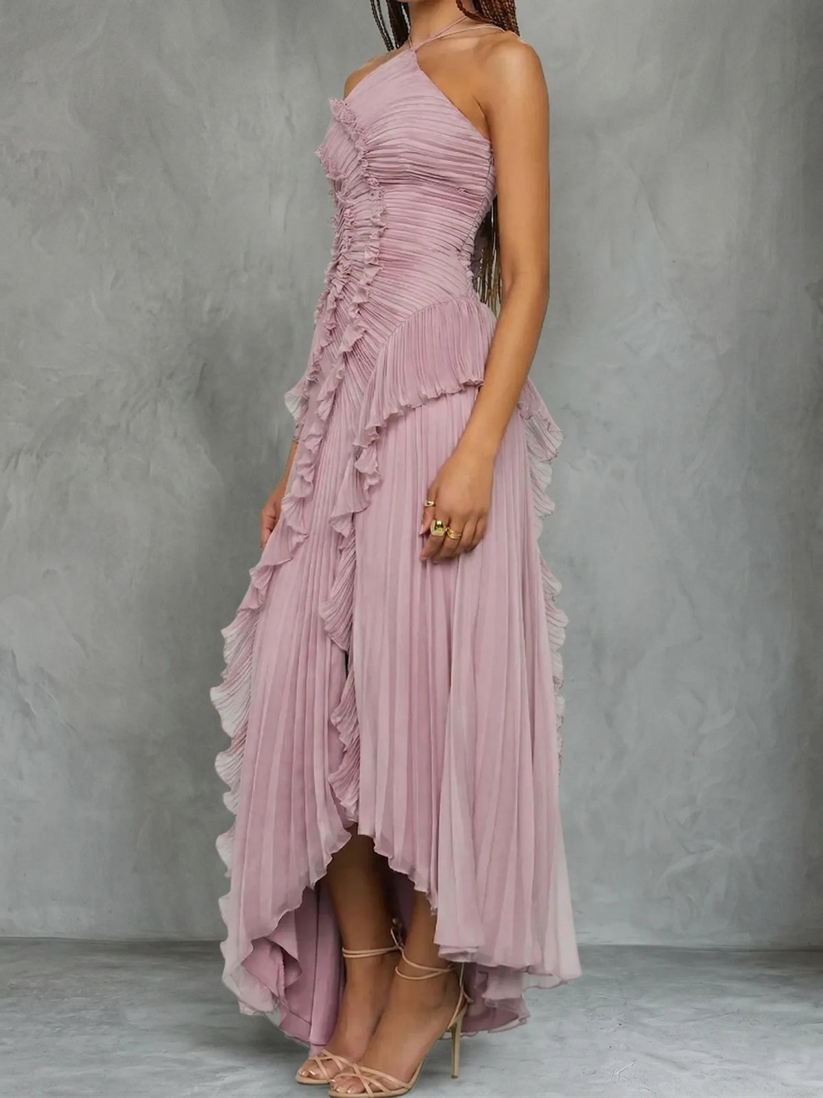 Women's lilac halter maxi dress with ruffles and asymmetric skirt, side view showing the asymmetric skirt
