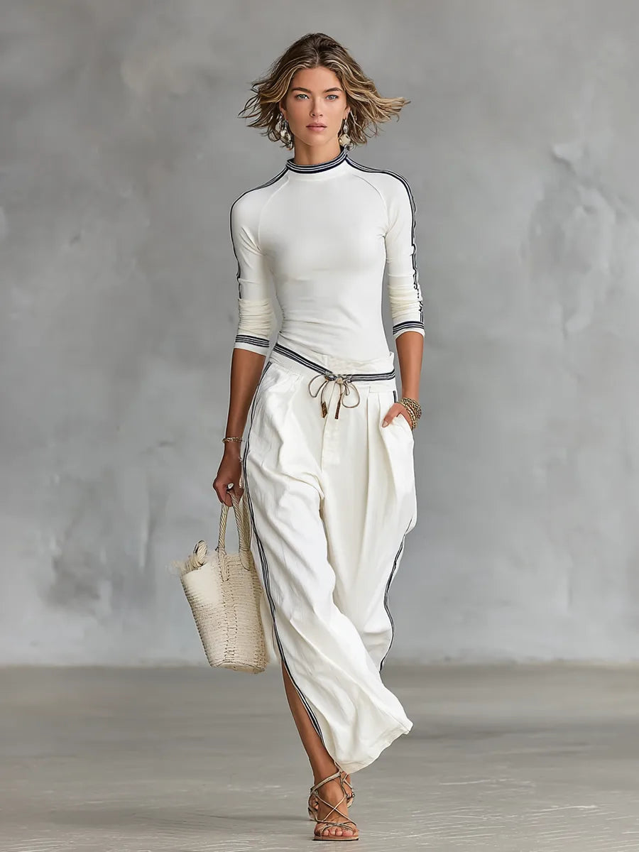 Women's mock-neck top and wide-leg drawstring pants set, white, front view with tote bag