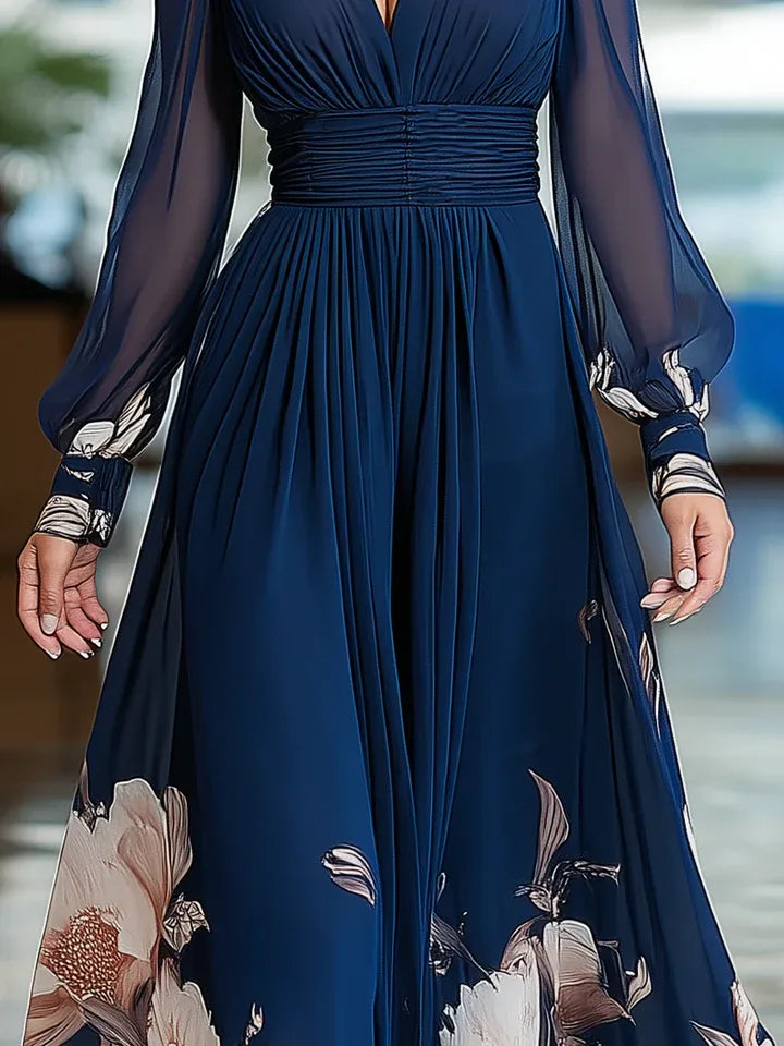 Women's navy floral V-neck maxi dress with sheer sleeves, close-up of the sleeves and floral hem