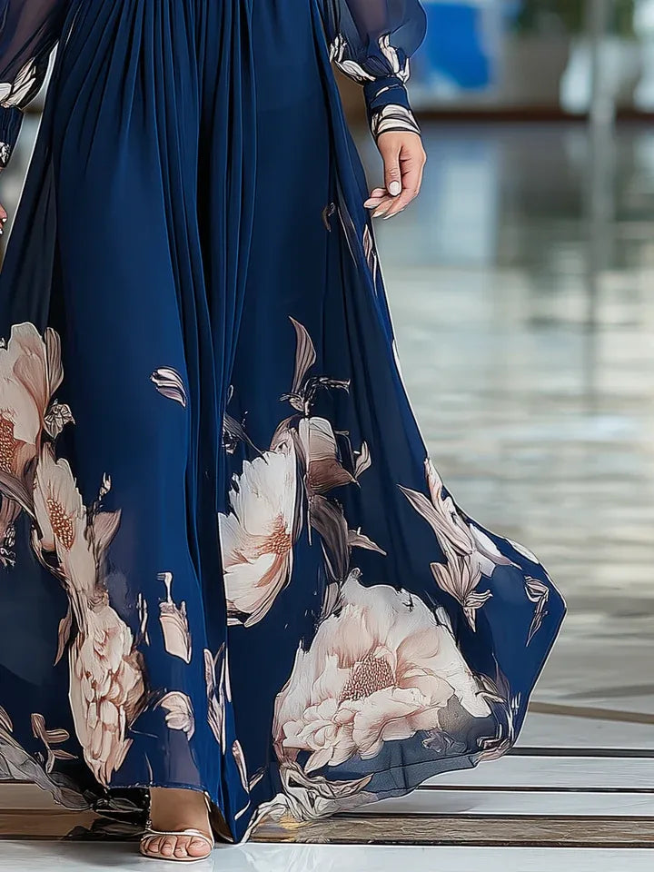 Women's navy floral V-neck maxi dress with sheer sleeves, skirt in motion