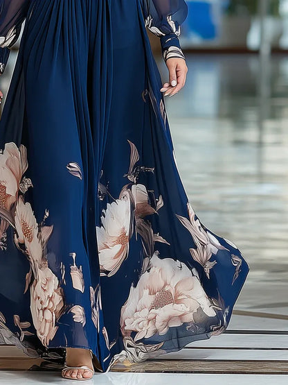 Women's navy floral V-neck maxi dress with sheer sleeves, skirt in motion
