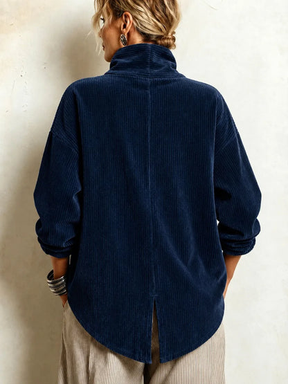 Women's navy high-collar jacket with diagonal buttons, back view