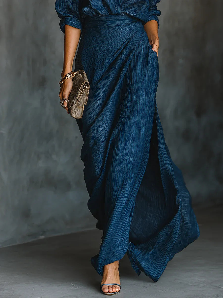 Women's navy shirt and long wrap skirt set, side view of the flowing skirt